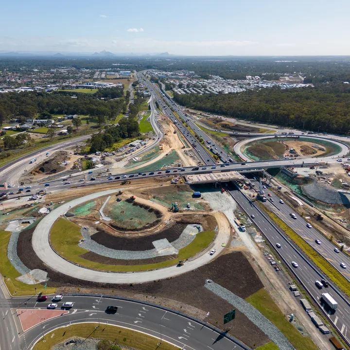 Aerial progress image of the Bruce Highway, Deception Bay Road interchange upgrade works during construction, looking north