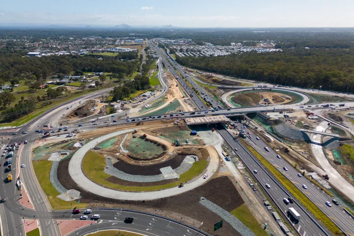 Aerial progress image of the Bruce Highway, Deception Bay Road interchange upgrade works during construction, looking north