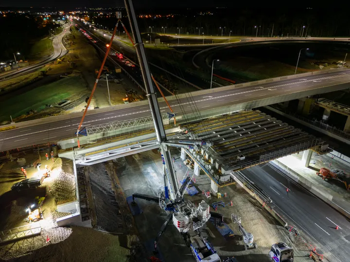 Girder installation for major new bridges spanning the Bruce Highway at the Deception Bay Road Interchange